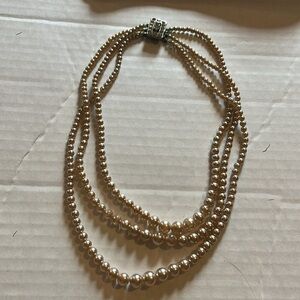 Vintage necklace-3 row,faux Ivory pearls with faux diamonds. Says Japan on back.